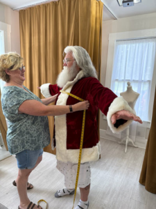 Santa being measured