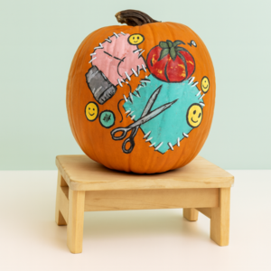 Embroidered pumkpin on a bench