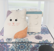Embroidered kitten pillow
